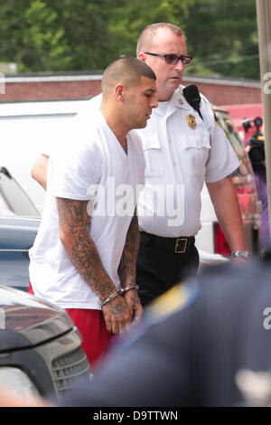 June 26, 2013 - Attelboro, Massachusetts, U.S. - Former New England Patriots tight end AARON HERNANDEZ wears handcuffs as he is escorted into Attleboro District Court on Wednesday. Hernandez has not been ruled out as a suspect in the death of semi-pro football player, 27-year-old Odin Lloyd who was found shot dead near the home of Hernandez. (Credit Image: © Nicolaus Czarnecki/METRO US/ZUMAPRESS.com) Stock Photo