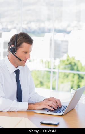 Businessman wearing a headset Stock Photo