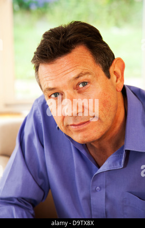 Portrait of a good looking mature man face to camera. Stock Photo