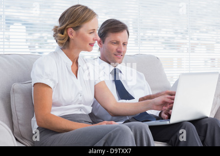 Business people watching something on laptop Stock Photo