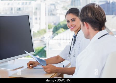 Pretty nurse holding a x ray Stock Photo