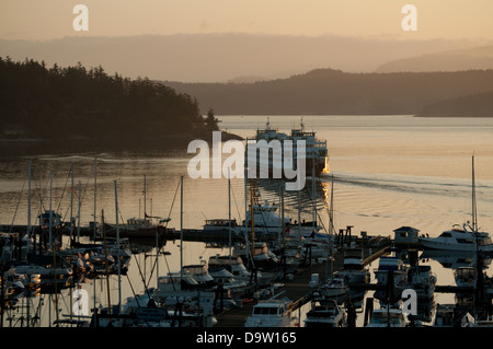 Washington State Ferry leaving Friday Harbor on San Juan Island,Washington at sunrise. Stock Photo