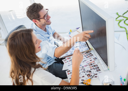 Attractive photo editors working on computer Stock Photo