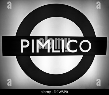 Black and white view of the famous London Underground logo at Pimlico Station on the Victoria line Stock Photo