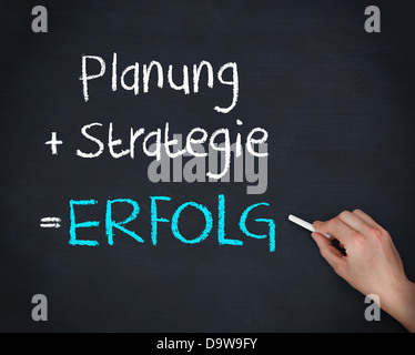 Man writing planung strategy and erfolg Stock Photo