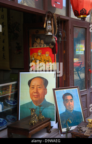 China, Shanxi Province, Pingyao County, Pingyao Ancient City, Shop Window, Political Posters including Mao Tse Tung Stock Photo