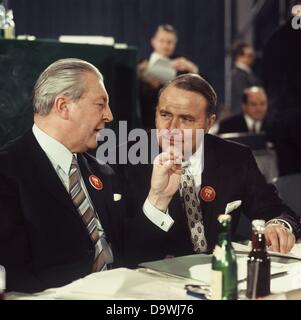 Former German chancellor Kurt Georg Kiesinger (l) talks to Alfred Dregger (r) in January 1971 on the CDU party conference in Duesseldorf. Stock Photo