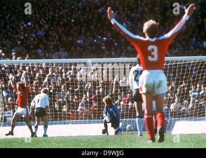 Austrian players jubilate after German defender Berti Vogts (2nd from left) has scored an own goal. German goalkeeper Sepp Maier looks after the ball in despair. In the end the Austrian team wins a stunning upset by hanging on to beat Germany by a score of 3-2 in their 1978 World Cup second round group game in Cordoba, Argentina on 21 June 1978. Germany is eliminated from competition and loses against Austria for the first time in 47 years. Stock Photo