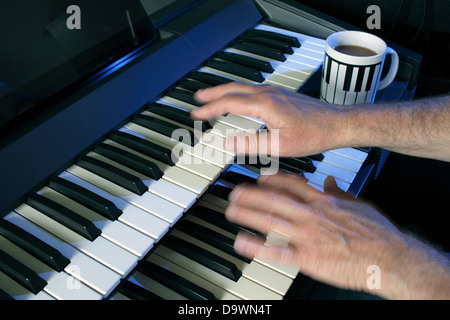 Playing a two manual electric keyboard. Stock Photo