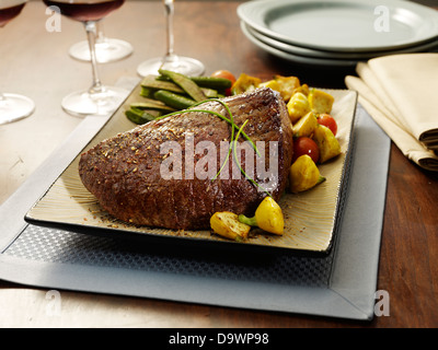 top round roast netted Stock Photo