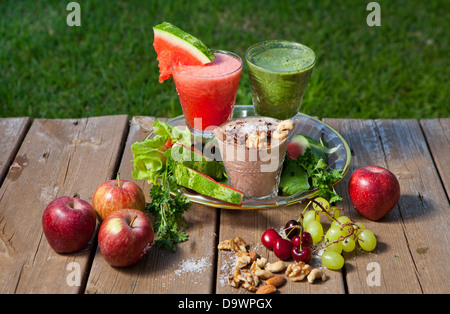 Fruit Smoothies - watermelon (left) grapes (right) nuts (centre) Stock Photo
