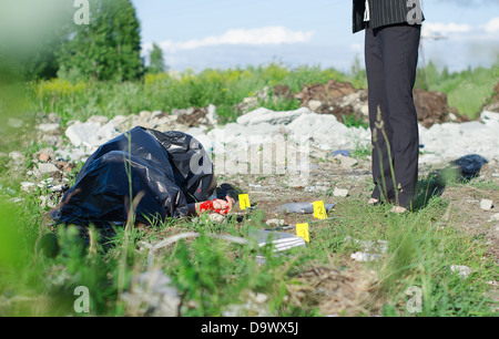 Young female criminalist inspecting crime scene Stock Photo