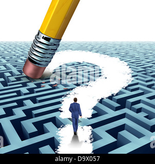 Leadership questions searching for solutions with a businessman walking through a complicated maze opened up by a pencil eraser Stock Photo