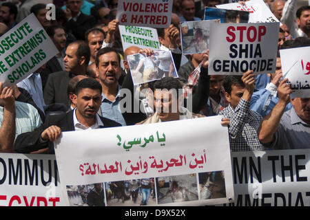 London, UK. 27th June 2013. Protesters with their banners as Egyptians in London protest against sectarian killings in Egypt. Credit:  Paul Davey/Alamy Live News Stock Photo