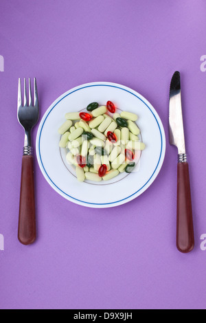 Variety of pills on plate Stock Photo