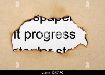 Progress text on paper hole Stock Photo