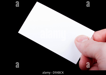 Man hand holding a blank business card. Stock Photo