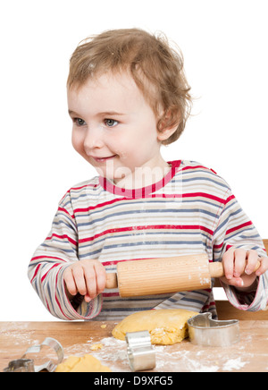 cute, laughing child with dough and rolling ping isolated on white background. horizontal image Stock Photo