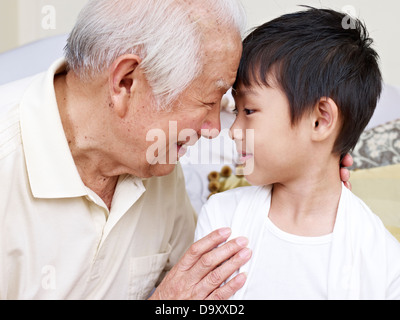 grandpa talking to grandson Stock Photo