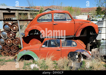 Scrap yard full of Volkswagen cars and vans. Near Moab, Utah, USA. Stock Photo