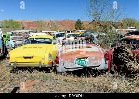 Scrap yard full of Volkswagen cars and vans. Near Moab, Utah, USA. Stock Photo