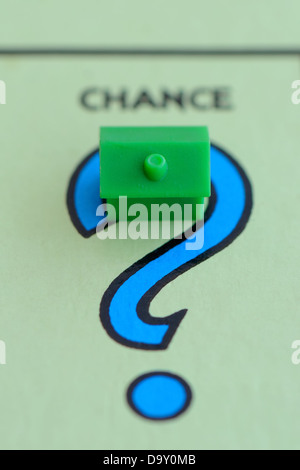 A concept image showing Monopoly game board, a house on the 'Chance' square. Stock Photo