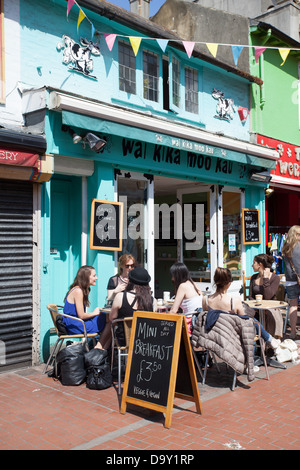 Young people having breakfast at Wai Kika Moo Kau a vegetarian/vegan restaurant in the North Laines, Brighton Stock Photo