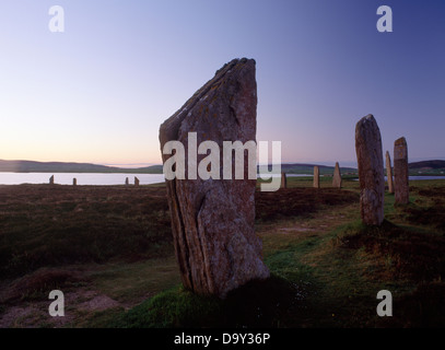Dawn at the Ring of Brodgar henge and stone circle, Orkney; looking through the eastern arc of stones to the Loch of Harray Stock Photo
