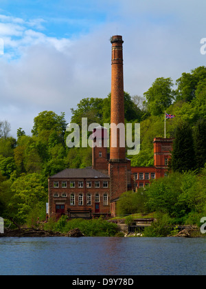 Masson Mill a former cotton mill now shops near Matlock Bath in Peak District Derbyshire England UK with River Derwent in front Stock Photo