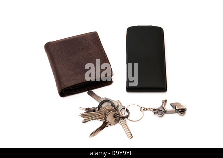 keys, wallet and cell phone case on a white background Stock Photo