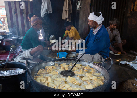 India, Uttar Pradesh, Aligarh, men preparing vegetable samosas Stock Photo