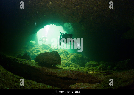 Mexico, Cozumel, Cenote Aerolito de Paraiso, Woman diving, high angle view Stock Photo