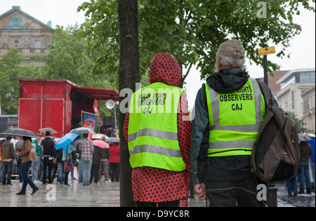 Observers from the Committee for the Administration of Justice watch events at an anti G8 protest in Belfast Stock Photo