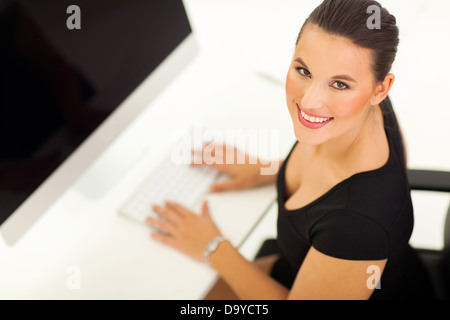 overhead view of cheerful businesswoman working on a modern computer Stock Photo