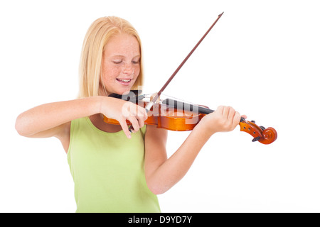 happy preteen girl playing violin against white background Stock Photo