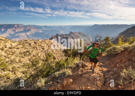 A man hiking on a trail. Stock Photo