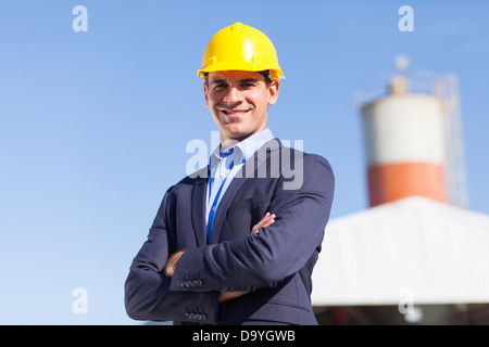 male industrial engineer in mining site with arms crossed Stock Photo