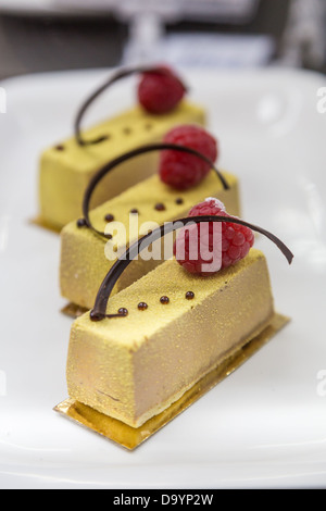 fresh pastrys with chocolate and raspberry in show-window Stock Photo