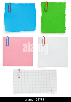 ragged note paper and clip isolated on white background Stock Photo