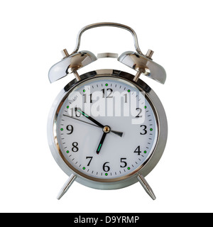 A classic alarm clock with the hammer showing movement as it rings the bells on a white background Stock Photo