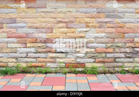brick wall with sidewalk Stock Photo