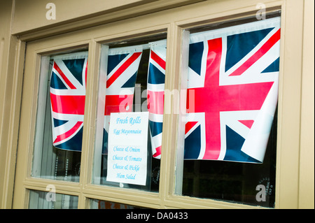 Union Jacks in a cafe window Ironbridge Shropshire UK Stock Photo