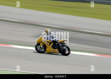 BARCELONA - APRIL 24: A motorcycle runs at Montmelo Circuit de Catalunya, a motorsport race track, on April 24, 2012. Stock Photo