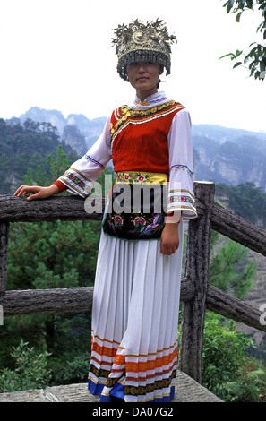 Chinese tourist wears rented garment of the Tujia minority people while visiting Zhangjiajie National Forest Park in Hunan province China Stock Photo