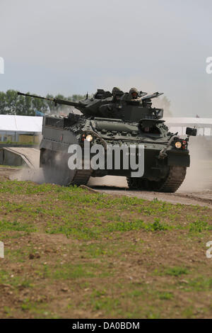 Bovington, UK. 29th June, 2013. The Warrior tracked vehicle family is a series of British armoured vehicles, originally developed to replace the older FV430 series of armoured vehicles. The Warrior started life as the MCV-80 project that was first broached in the 1970s, GKN Sankey/Defence winning the production contract in 1980. GKN Defence was subsequently purchased by BAE Systems (via Alvis plc). Stock Photo