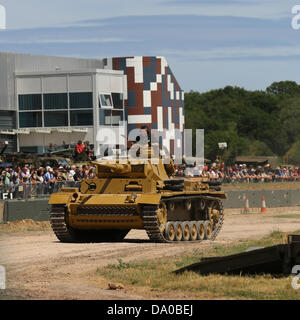 Bovington, UK. 29th June, 2013. Panzer III was the common name of a medium tank that was developed in the 1930s by Germany and was used extensively in World War II. The official German designation was Panzerkampfwagen III Sd Kfz. 141 (abbreviated PzKpfw III) translating as 'armoured fighting vehicle'. It was intended to fight other armoured fighting vehicles and serve alongside the infantry-supporting Panzer IV; however, as the Germans faced the formidable T-34, stronger anti-tank guns were needed. Since the Panzer IV had a bigger turret ring, the role was reversed. Stock Photo