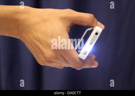 A Taser stun gun disguised as an iPhone. The stealth stun gun delivers 4.8 million volts. Stock Photo