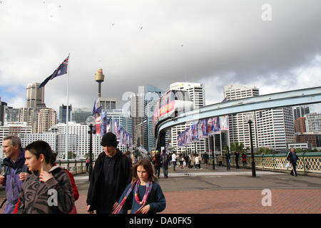 Sydney, NSW, Australia. 30 June 2013. There were long queues as people tried to ride the Sydney Monorail for one last time on its final day of operation. The monorail infrastructure will be removed to make way for a new convention centre at Darling Harbour. Credit: Credit:  Richard Milnes / Alamy Live News. Stock Photo