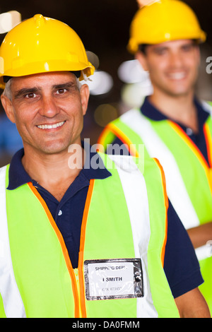 two happy shipping and warehouse worker portrait Stock Photo