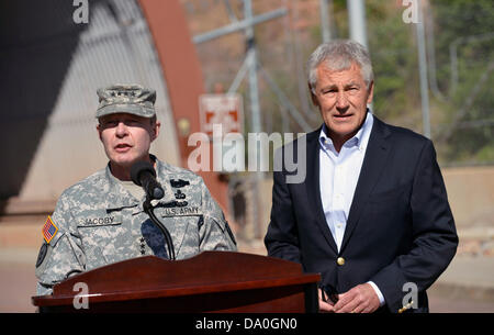 US Secretary of Defense Chuck Hagel and NORTHCOM commander Gen. Chuck Jacoby speak to the media outside the entrance of Cheyenne Mountain Air Force Station as he visits USNORTHCOM June 28, 2013 in Colorado Springs, CO.